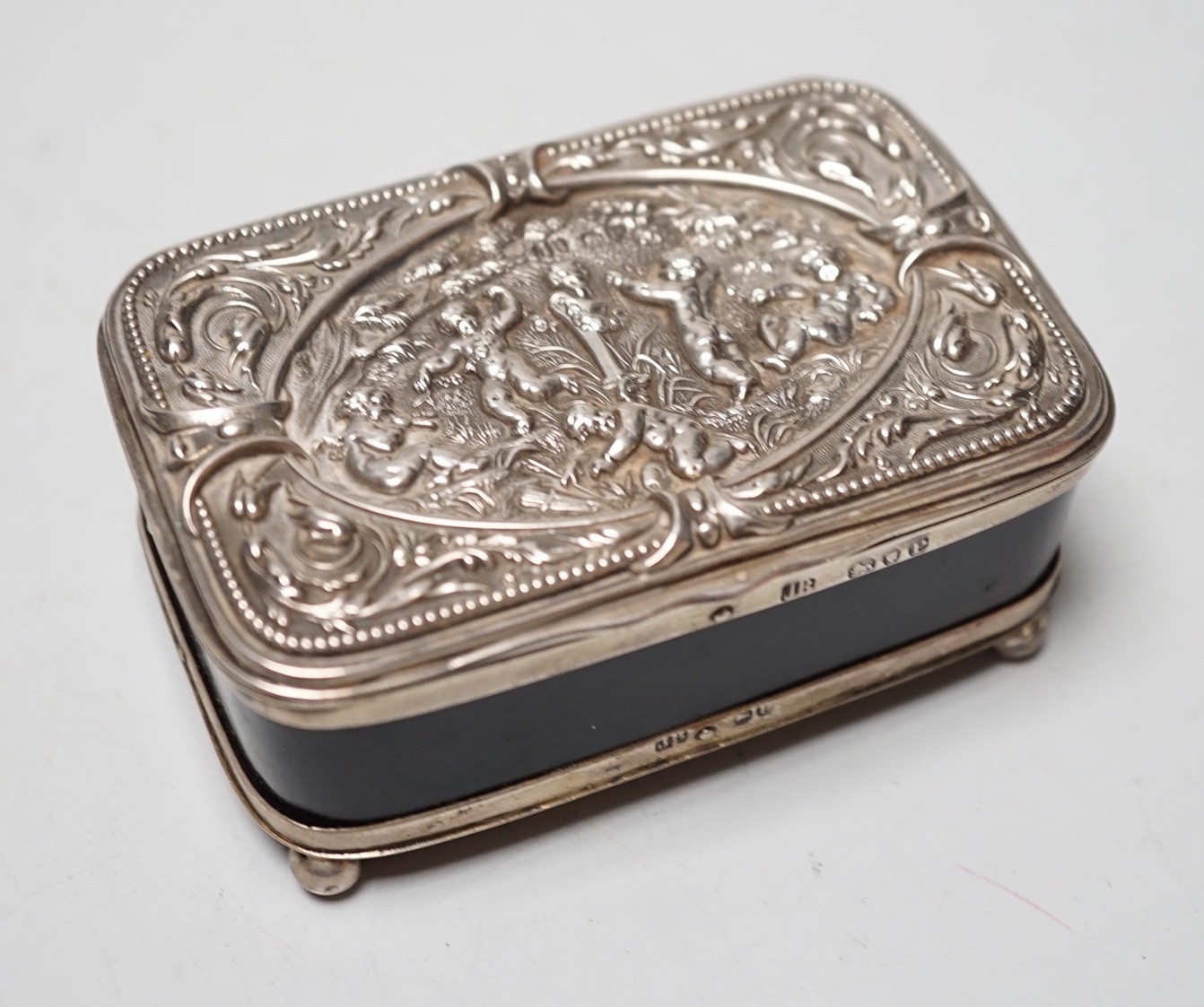 A late Victorian silver mounted tortoiseshell rectangular box and cover, on ball feet, Joseph Braham, London, 1890, 85mm.